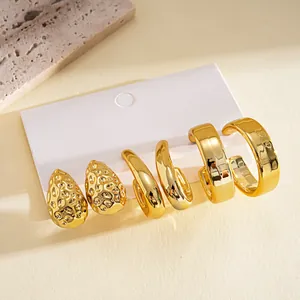 Detailed view of a 6-piece gold earring set featuring textured teardrop and C-shape designs