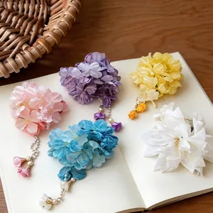 Elegant fabric flower hair clips with pearl tassels in assorted colors for vacation styling