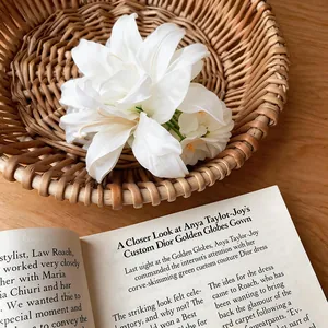 Close-up detail of a realistic white fabric flower hair clip set in a rustic woven basket
