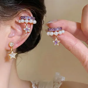 Eleganti orecchini a stella con zircone viola e perle dorate