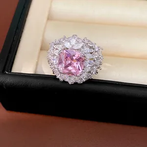 Exquisite pink cushion-cut zircon ring with floral halo set in luxury jewelry box