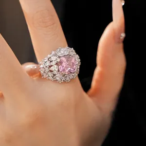 Luxurious palace style open ring featuring a large pink square zircon and marquise stones