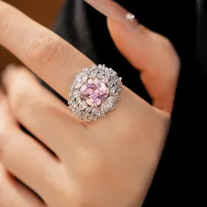 Detailed view of an elegant vintage palace style open ring with a pink zircon stone