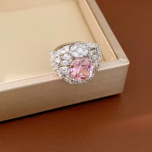 Macro view of an elegant palace style adjustable ring with a pink cushion-cut stone
