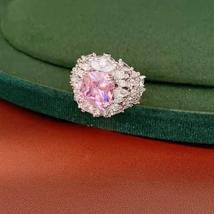 Close-up view of vintage palace style luxury ring with large pink cushion-cut central zircon