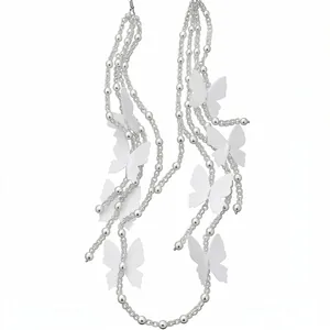 Elegant pearl beaded tassel earrings with white chiffon butterflies on silver hooks.