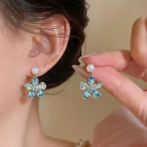 Luxurious silver flower drop earrings with light blue crystals and pearls for women