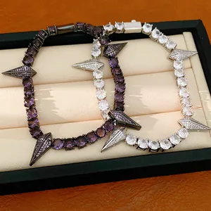 Close-up detail of luxury zircon punk bracelets with sharp spike pendants on display