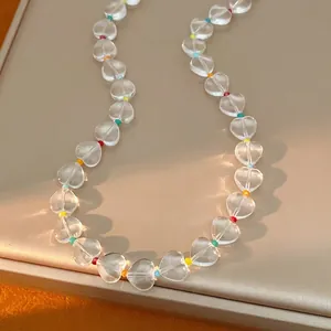 Elegant transparent heart crystal beaded necklace with colorful spacers on display