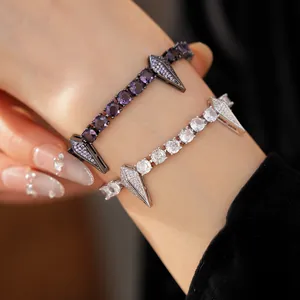 Detailed macro shot of punk style zircon bracelets with round stones and spiked charms