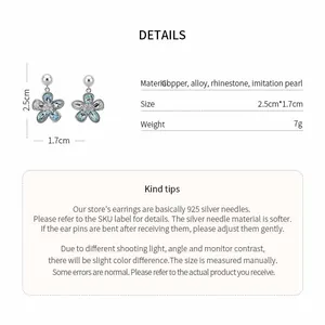 Detailed view of flower pendant pearl stud earrings with 925 silver needles and rhinestones