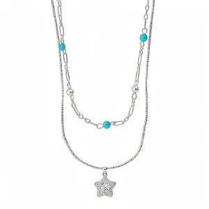 Elegant double-layered silver necklace featuring a star pendant, blue beads and pearls