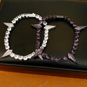 Close-up of hip-hop punk bracelets with purple and white zircon spiked charms