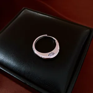 Detailed shot of a vintage silver-colored wave open ring with marquise zircon.