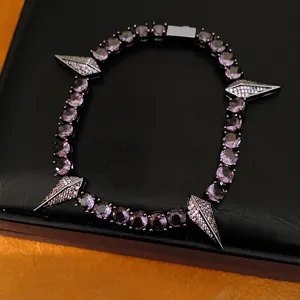 Detailed macro view of purple zircon bracelet with silver diamond-set punk spikes