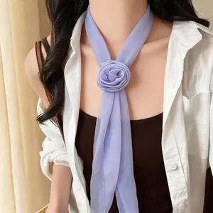 Elegant light purple chiffon scarf necklace with a delicate flower detail on model