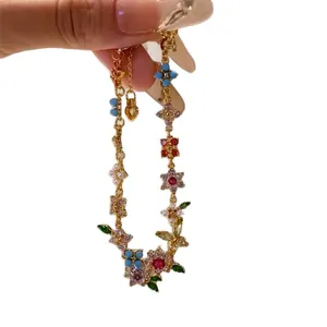 Elegant 18k gold plated charm bracelet with colorful zircon flowers and pearl accents