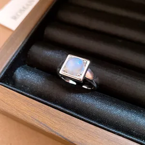 Close-up of minimalist square stone open ring in silver-plated finish