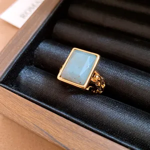 Luxurious 18k gold plated rectangular stone open ring displayed in a black velvet jewelry box