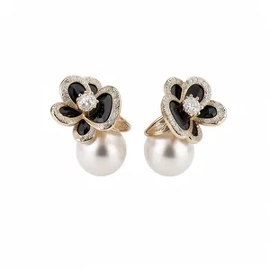Vintage 14k gold plated flower earrings with black petals and large white pearls