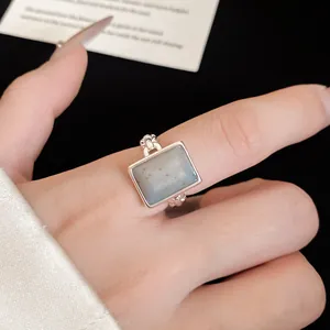 Detailed macro shot of an elegant square stone open ring with silver-plated finish