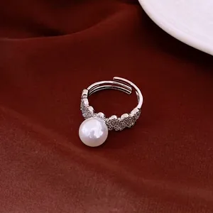 Elegant lace pearl ring with sparkling rhinestones in a vintage silver finish.