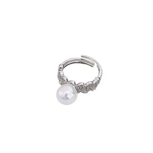 Elegant adjustable lace ring with a large white pearl and sparkling pavé accents