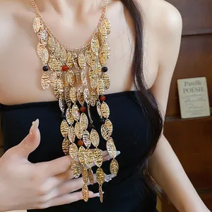 Vintage gold metal wrinkled oval fringe necklace with red and black agate beads detail