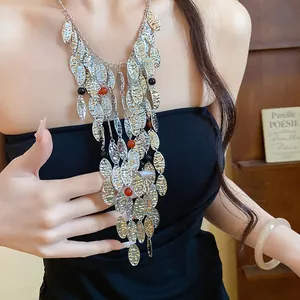 Vintage-style pleated metallic oval tassel necklace with red and black agate beads detail