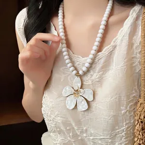 Elegant white floral pendant beaded necklace for bohemian beach vacation style accessories