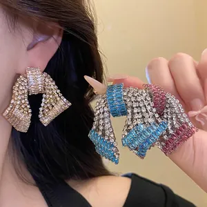 Glamorous statement bow stud earrings with sparkling baguette zircons in various colors