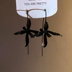 Elegant black painted metal flower drop earrings featuring a unique minimalist aesthetic