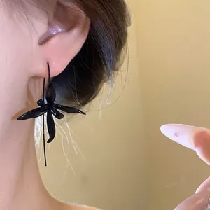 Elegant black flower pendant hook earrings with a painted metal finish for women