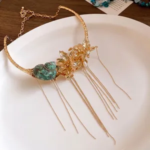Vintage gold flower and seashell choker necklace featuring elegant tassel chain details