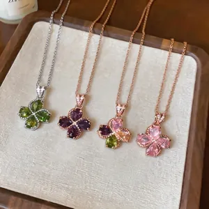 Elegant zircon flower drop necklaces in various colors with adjustable chains.