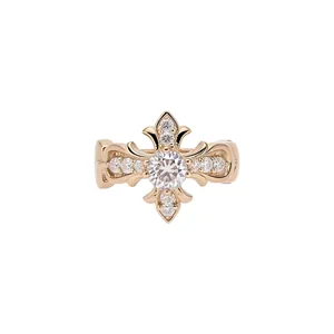 Elegant gold fleur-de-lis ear cuff with sparkling cubic zirconia stones centerpiece