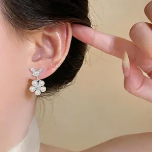 Elegant French style zircon butterfly stud earrings with pearl flower charms on ear