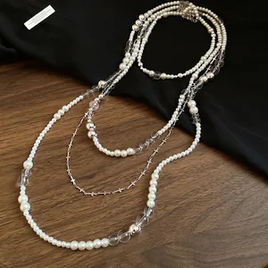 French vintage style pearl beaded necklace set featuring silver cross charms for women