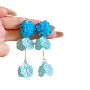 Elegant blue hydrangea tassel petal drop earrings with handcrafted beadwork details.
