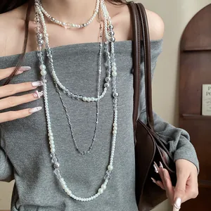 Detailed view of elegant French retro 4-piece layered pearl and cross necklace jewelry