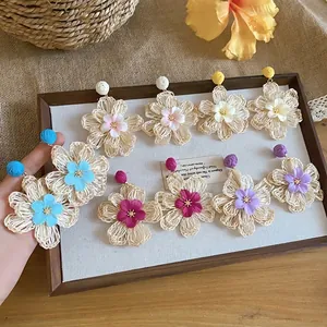 Bohemian raffia flower earrings in various colors for stylish summer vacation