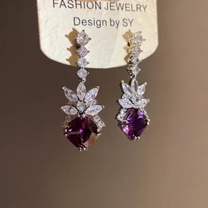 Elegant vintage drop earrings featuring purple diamond-shaped zirconia and silver needle.