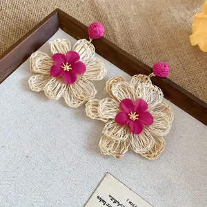 Bohemian raffia flower earrings with fuchsia silk flower center for summer vacations