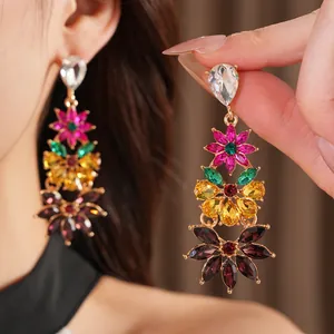 Detail shot of colorful floral dangle earrings featuring multi-color marquise rhinestones