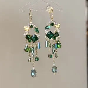 Elegant green glass geometric faceted beaded tassel earrings in gold-tone finish