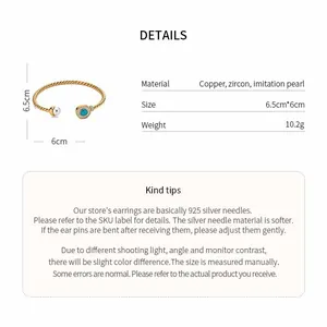 Detailed specification view of minimalist gold cuff bracelet with pearl and zircon detail