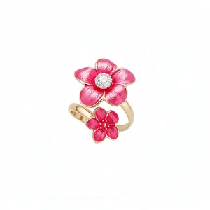 Elegant gold-plated adjustable ring featuring two pink enamel flowers with center crystal