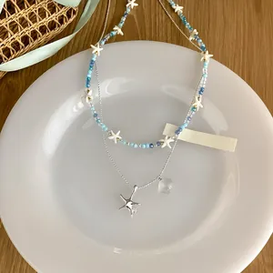 Collier double couche en perles de cristal étoile de mer avec breloques argentées style été