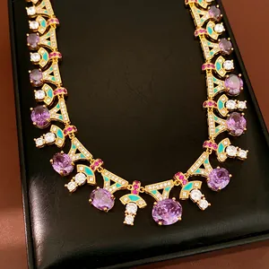Luxury palace style necklace with purple stones and turquoise enamel details close-up