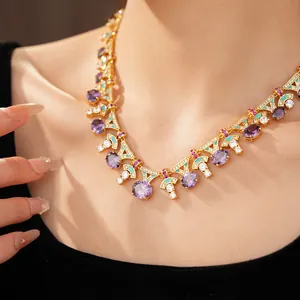 Macro view of an elegant court style enamel necklace featuring oval purple zircon stones